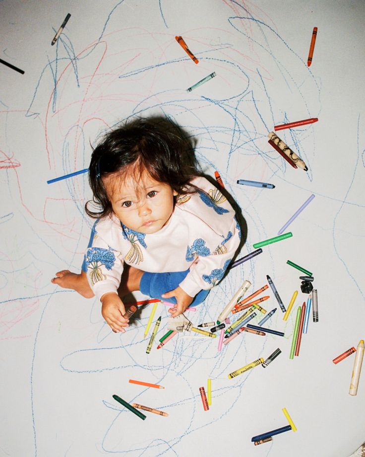 An educator drawing with children at Lumio Early Learning