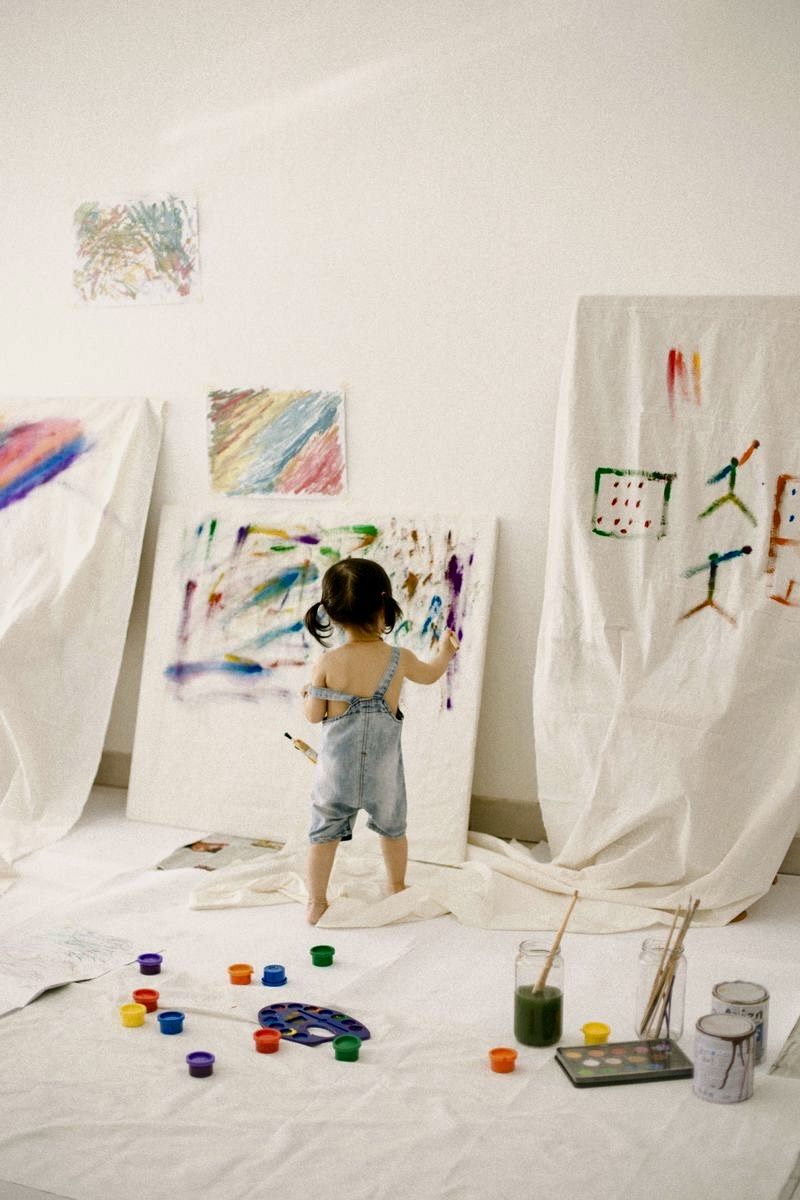 A child concentrating on a painting
